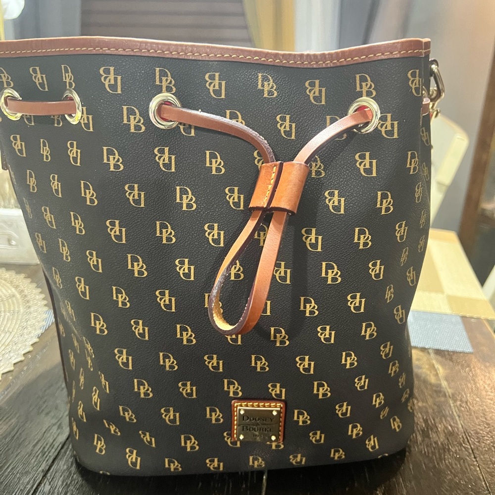 Dooney & Bourke Black and Gold Monogram Bucket Bag